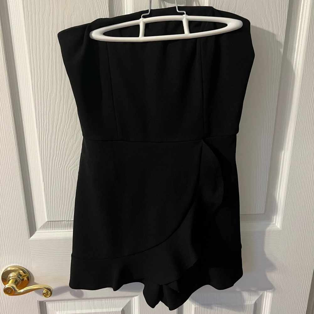 Strapless Black romper with front ruffle